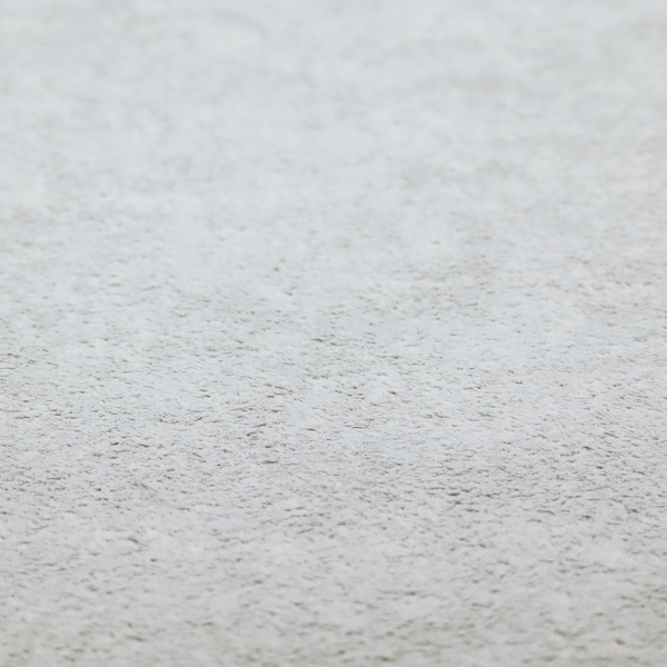 This fabric features a high-pile faux fur texture that offers a cool-toned, plush aesthetic with a rich tactile quality.