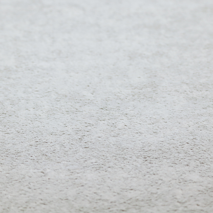 This fabric features a high-pile faux fur texture that offers a cool-toned, plush aesthetic with a rich tactile quality.