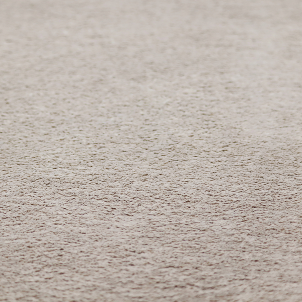 This fabric features a high-pile faux fur texture that offers a warm, neutral aesthetic with a soft and tactile quality.