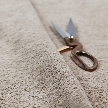 This fabric features a high-pile faux fur texture that offers a warm, neutral aesthetic with a soft and tactile quality.