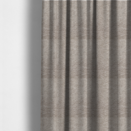 The fabric used to create these made-to-measure curtains features a high-pile faux fur texture that offers a warm, neutral aesthetic with a soft and tactile quality.