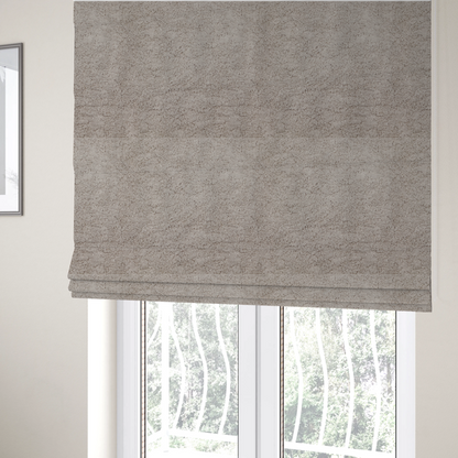 The fabric used to create these Roman blinds features a high-pile faux fur texture that offers a warm, neutral aesthetic with a soft and tactile quality.