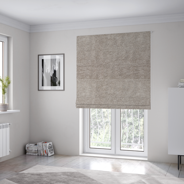 The fabric used to create these Roman blinds features a high-pile faux fur texture that offers a warm, neutral aesthetic with a soft and tactile quality.
