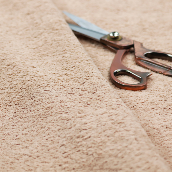 This fabric features a high-pile faux fur texture that offers a warm, inviting aesthetic with a soft and tactile quality.