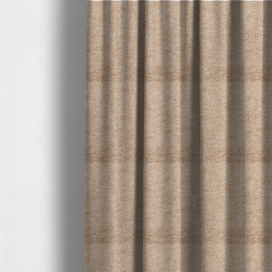 The fabric used to create these made-to-measure curtains features a high-pile faux fur texture that offers a warm, inviting aesthetic with a soft and tactile quality.