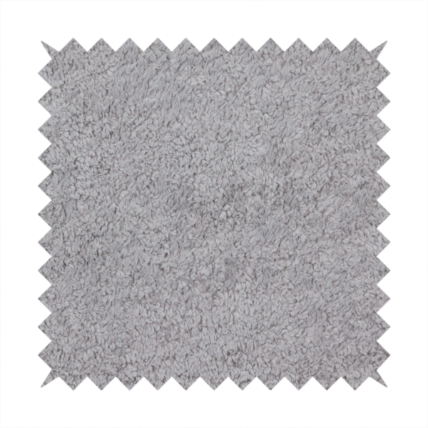This fabric features a high-pile faux fur texture that offers a sophisticated, cool-neutral aesthetic with a soft and tactile quality.