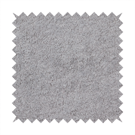 This fabric features a high-pile faux fur texture that offers a sophisticated, cool-neutral aesthetic with a soft and tactile quality.