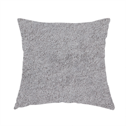 The fabric used to create this handmade cushion features a high-pile faux fur texture that offers a sophisticated, cool-neutral aesthetic with a soft and tactile quality.