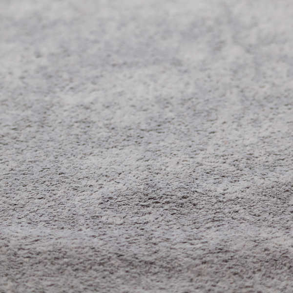 This fabric features a high-pile faux fur texture that offers a sophisticated, cool-neutral aesthetic with a soft and tactile quality.