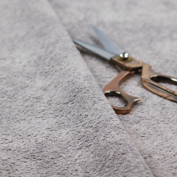 This fabric features a high-pile faux fur texture that offers a sophisticated, cool-neutral aesthetic with a soft and tactile quality.