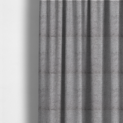 The fabric used to create these made-to-measure curtains features a high-pile faux fur texture that offers a sophisticated, cool-neutral aesthetic with a soft and tactile quality.