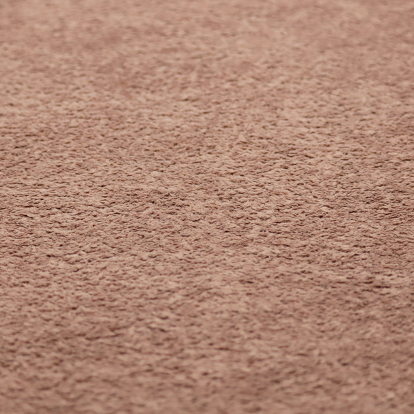 This fabric features a high-pile faux fur texture that provides a warm, sophisticated aesthetic with a rich tactile quality.