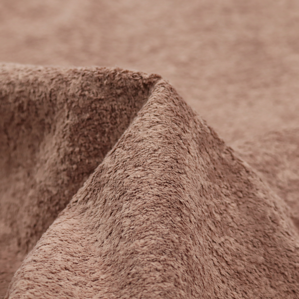 This fabric features a high-pile faux fur texture that provides a warm, sophisticated aesthetic with a rich tactile quality.