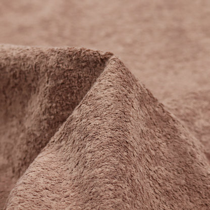 This fabric features a high-pile faux fur texture that provides a warm, sophisticated aesthetic with a rich tactile quality.