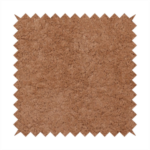 This fabric features a high-pile faux fur texture that provides a rich, earthy aesthetic with a soft and plush tactile quality.