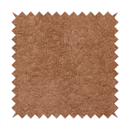 This fabric features a high-pile faux fur texture that provides a rich, earthy aesthetic with a soft and plush tactile quality.