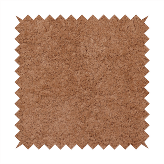 This fabric features a high-pile faux fur texture that provides a rich, earthy aesthetic with a soft and plush tactile quality.