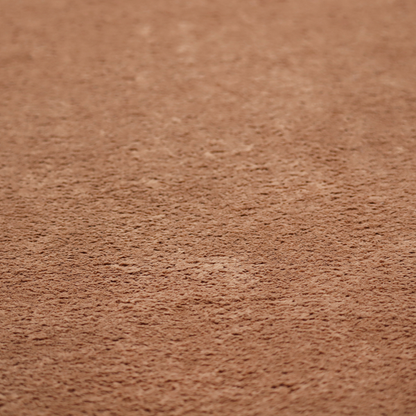 This fabric features a high-pile faux fur texture that provides a rich, earthy aesthetic with a soft and plush tactile quality.