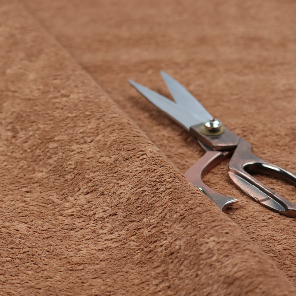 This fabric features a high-pile faux fur texture that provides a rich, earthy aesthetic with a soft and plush tactile quality.