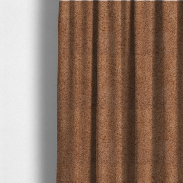 The fabric used to create these made-to-measure curtains features a high-pile faux fur texture that provides a rich, earthy aesthetic with a soft and plush tactile quality.