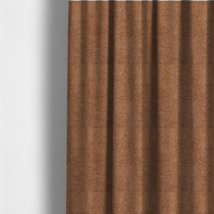 The fabric used to create these made-to-measure curtains features a high-pile faux fur texture that provides a rich, earthy aesthetic with a soft and plush tactile quality.
