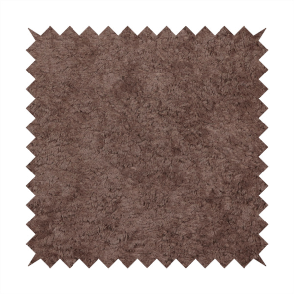 This fabric features a high-pile faux fur texture that offers a deep, grounded aesthetic with a soft and plush tactile quality.