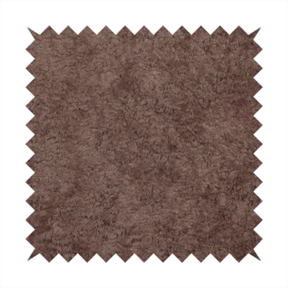 This fabric features a high-pile faux fur texture that offers a deep, grounded aesthetic with a soft and plush tactile quality.