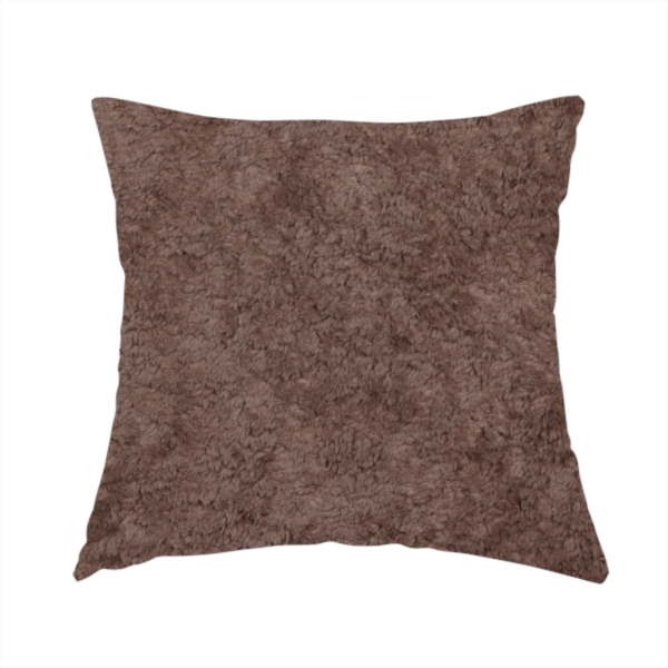 The fabric used to create this handmade cushion features a high-pile faux fur texture that offers a deep, grounded aesthetic with a soft and plush tactile quality.