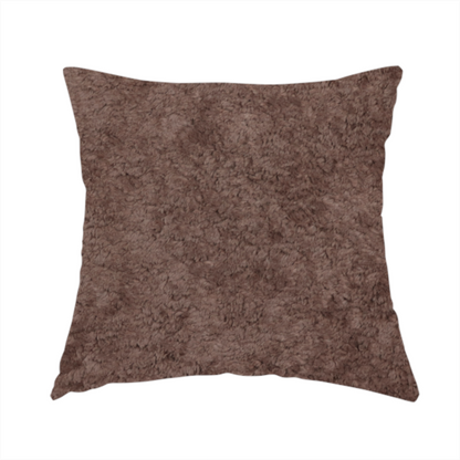 The fabric used to create this handmade cushion features a high-pile faux fur texture that offers a deep, grounded aesthetic with a soft and plush tactile quality.
