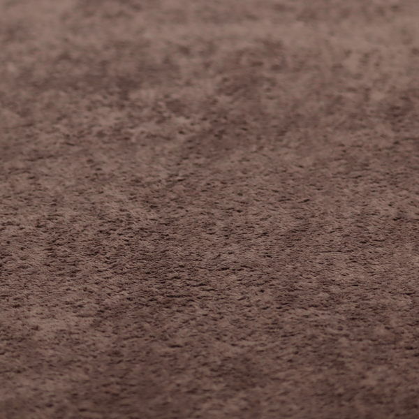This fabric features a high-pile faux fur texture that offers a deep, grounded aesthetic with a soft and plush tactile quality.