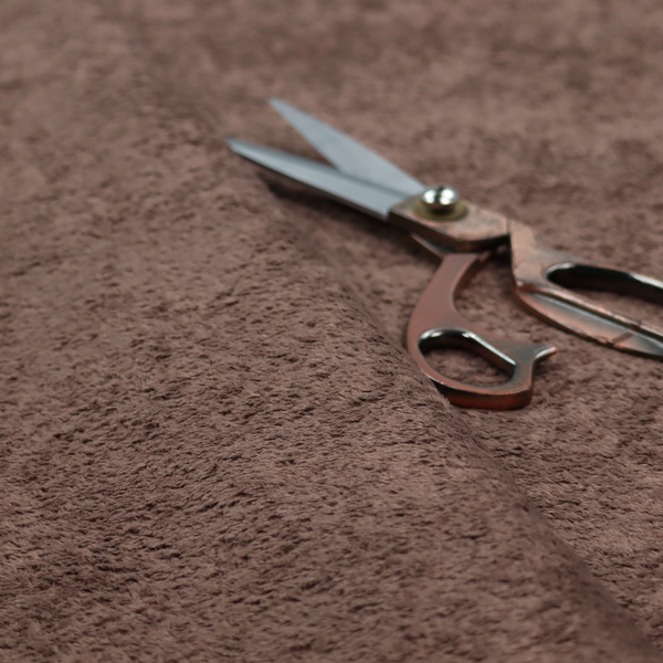 This fabric features a high-pile faux fur texture that offers a deep, grounded aesthetic with a soft and plush tactile quality.