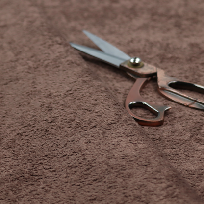 This fabric features a high-pile faux fur texture that offers a deep, grounded aesthetic with a soft and plush tactile quality.