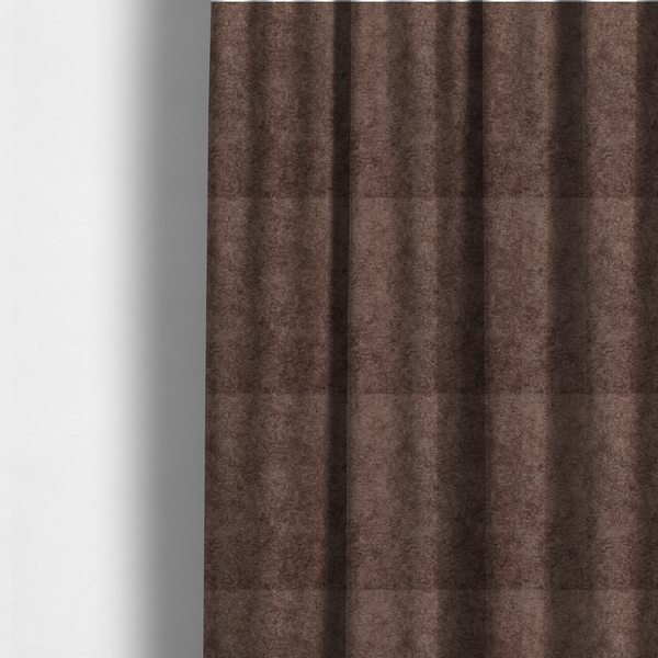 The fabric used to create these made-to-measure curtains features a high-pile faux fur texture that offers a deep, grounded aesthetic with a soft and plush tactile quality.