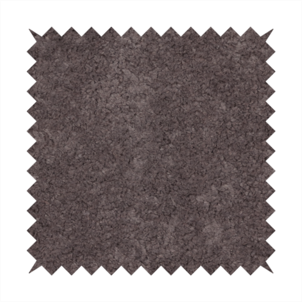 This fabric features a high-pile faux fur texture that offers a deep, moody aesthetic with a soft and plush tactile quality.