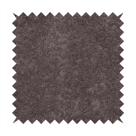 This fabric features a high-pile faux fur texture that offers a deep, moody aesthetic with a soft and plush tactile quality.