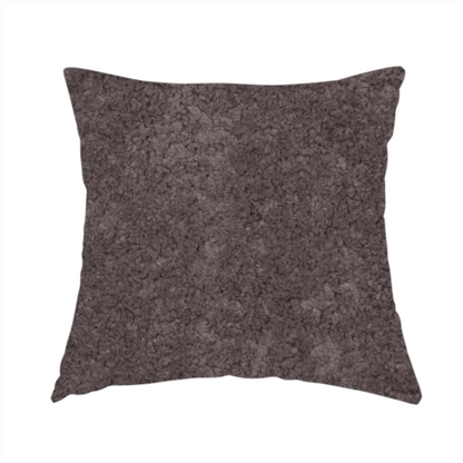 The fabric used to create this handmade cushion features a high-pile faux fur texture that offers a deep, moody aesthetic with a soft and plush tactile quality.