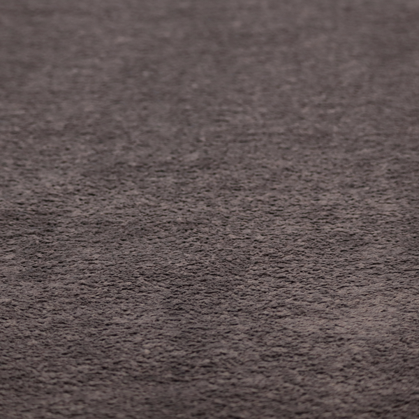 This fabric features a high-pile faux fur texture that offers a deep, moody aesthetic with a soft and plush tactile quality.