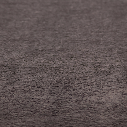 This fabric features a high-pile faux fur texture that offers a deep, moody aesthetic with a soft and plush tactile quality.