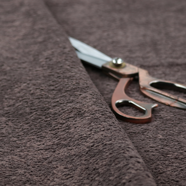 This fabric features a high-pile faux fur texture that offers a deep, moody aesthetic with a soft and plush tactile quality.