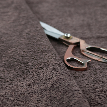 This fabric features a high-pile faux fur texture that offers a deep, moody aesthetic with a soft and plush tactile quality.