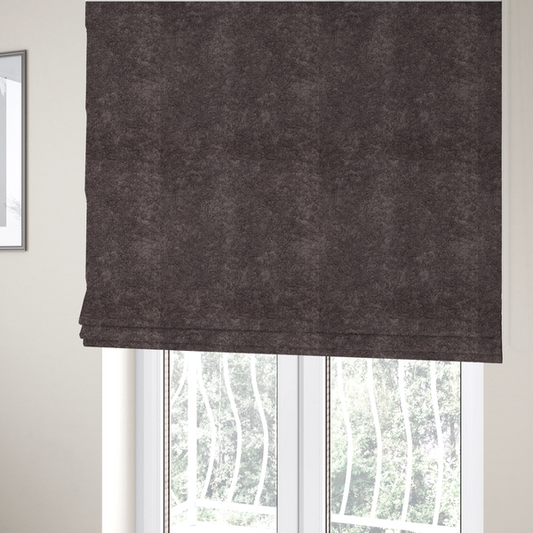 The fabric used to create these Roman blinds features a high-pile faux fur texture that offers a deep, moody aesthetic with a soft and plush tactile quality.