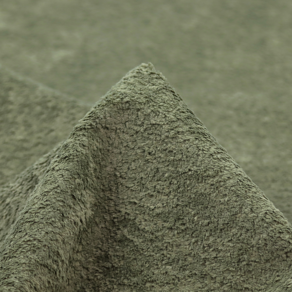 This fabric features a high-pile faux fur texture that offers a natural, serene aesthetic with a soft and plush tactile quality.