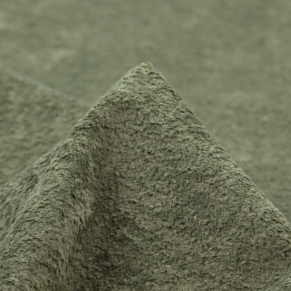 This fabric features a high-pile faux fur texture that offers a natural, serene aesthetic with a soft and plush tactile quality.