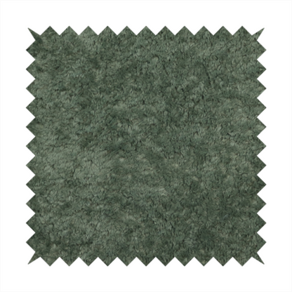 A soft, textured fabric in a rich, earthy green shade. The surface features a dense, uniform, and plush pile, characteristic of thick fleece or absorbent terry cloth material.