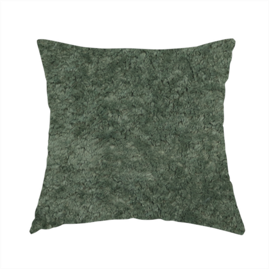 The fabric used to create this handmade cushion is a soft, textured fabric in a rich, earthy green shade. The surface features a dense, uniform, and plush pile, characteristic of thick fleece or absorbent terry cloth material.
