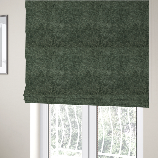 The fabric used to create these Roman blinds is a soft, textured fabric in a rich, earthy green shade. The surface features a dense, uniform, and plush pile, characteristic of thick fleece or absorbent terry cloth material.