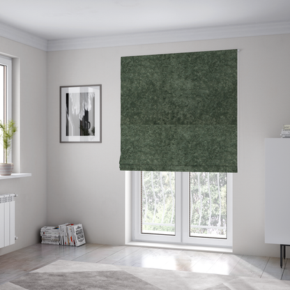 The fabric used to create these Roman blinds is a soft, textured fabric in a rich, earthy green shade. The surface features a dense, uniform, and plush pile, characteristic of thick fleece or absorbent terry cloth material.