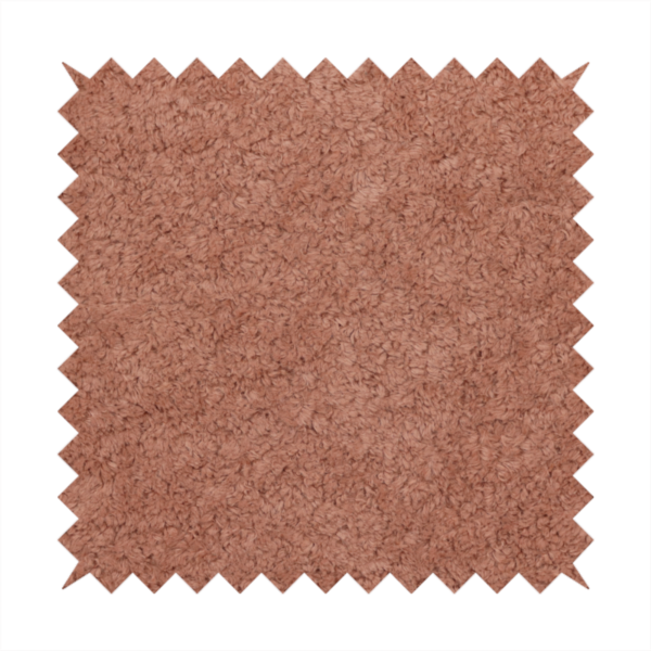 A soft, textured fabric in a muted, dusty rose shade, featuring a dense, uniform, and plush pile like thick fleece or terry.