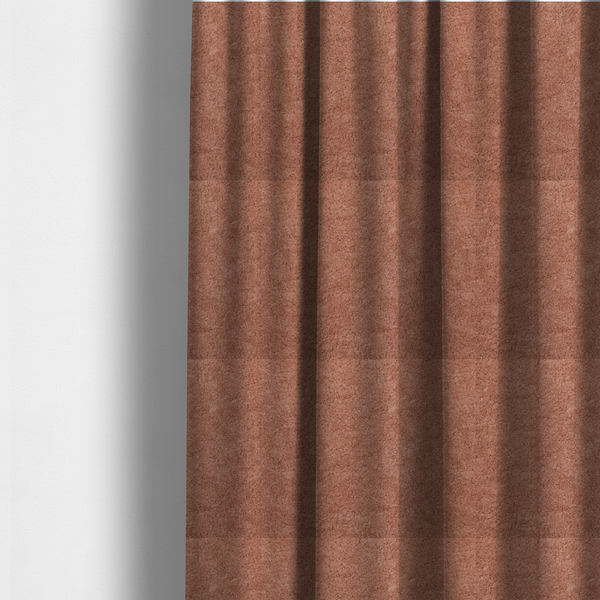 The fabric used to create these made-to-measure curtains is a soft, textured fabric in a muted, dusty rose shade, featuring a dense, uniform, and plush pile like thick fleece or terry.