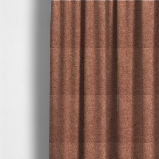 The fabric used to create these made-to-measure curtains is a soft, textured fabric in a muted, dusty rose shade, featuring a dense, uniform, and plush pile like thick fleece or terry.